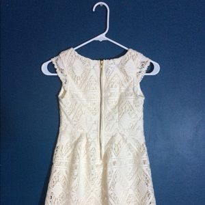 Creame-colored girl’s lace dress